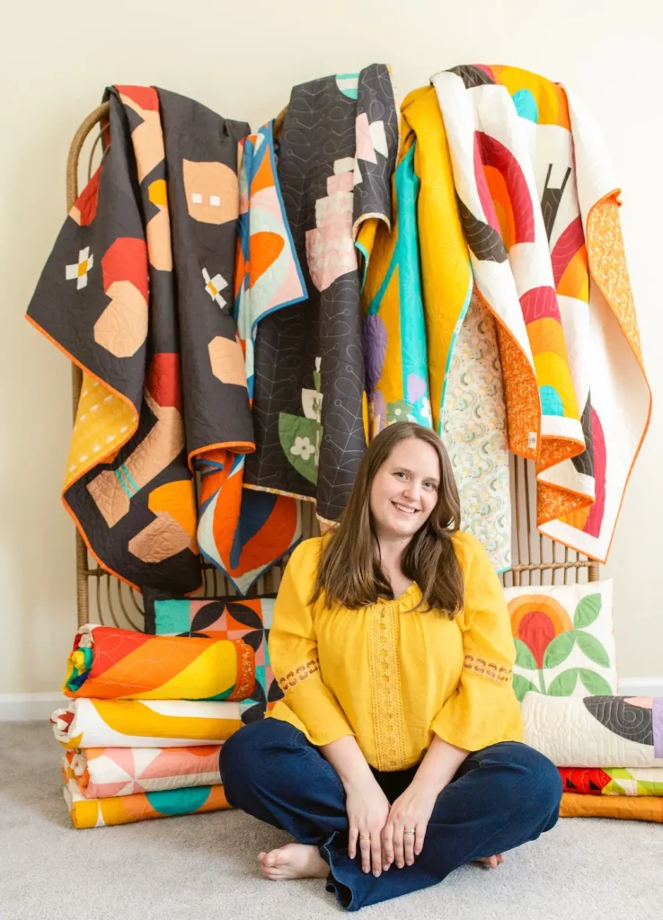 Erin Grogan with some of her quilts