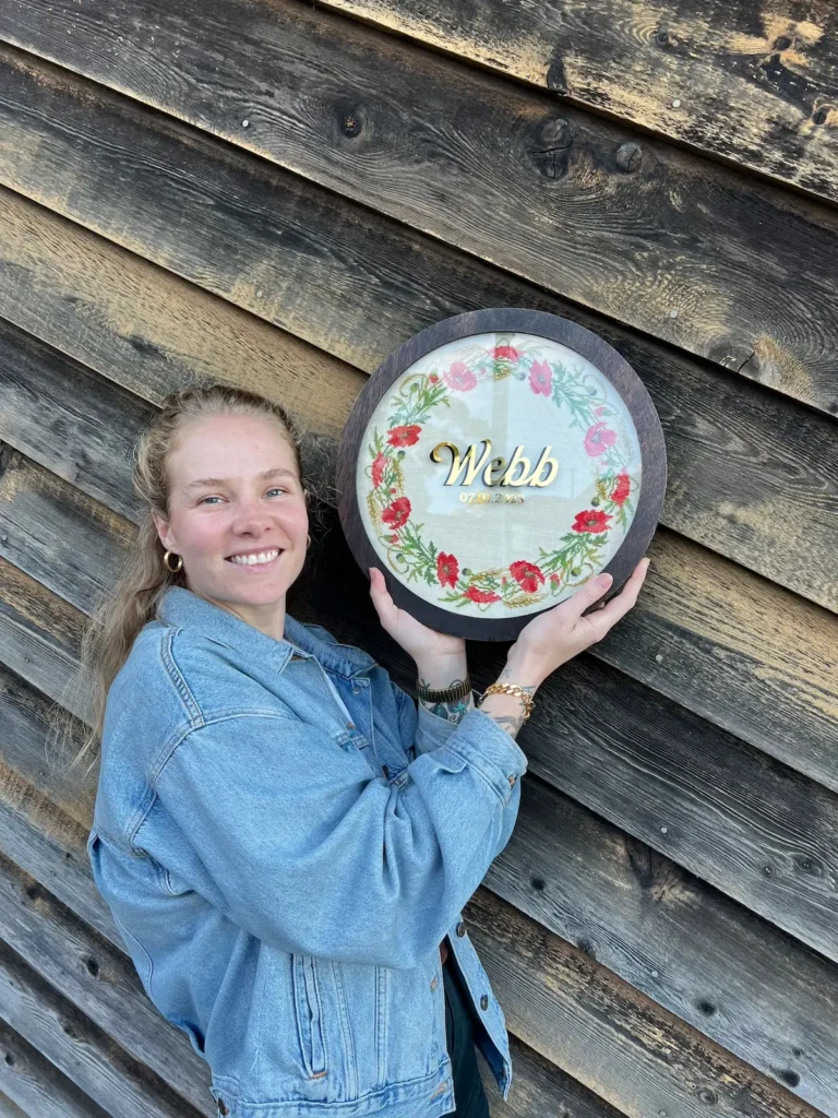 Maddie Jones with a crossstitch for Webb