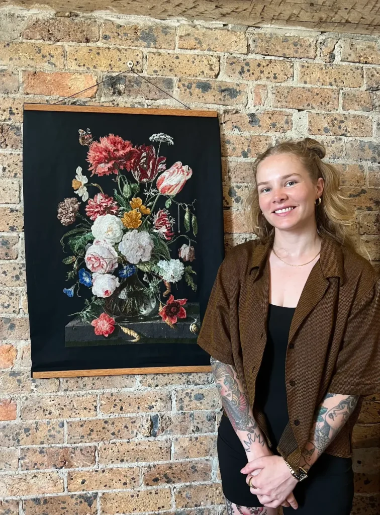 Maddie Jones with one of her detailed flower crossstitch projects