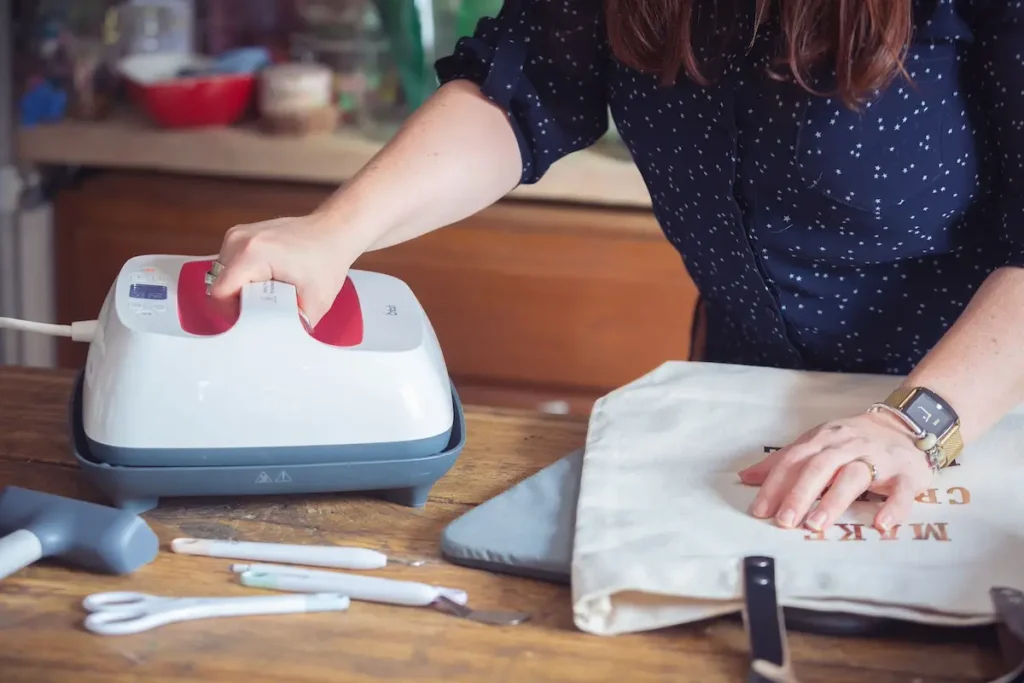Paula Milner pressing her cricut cuts