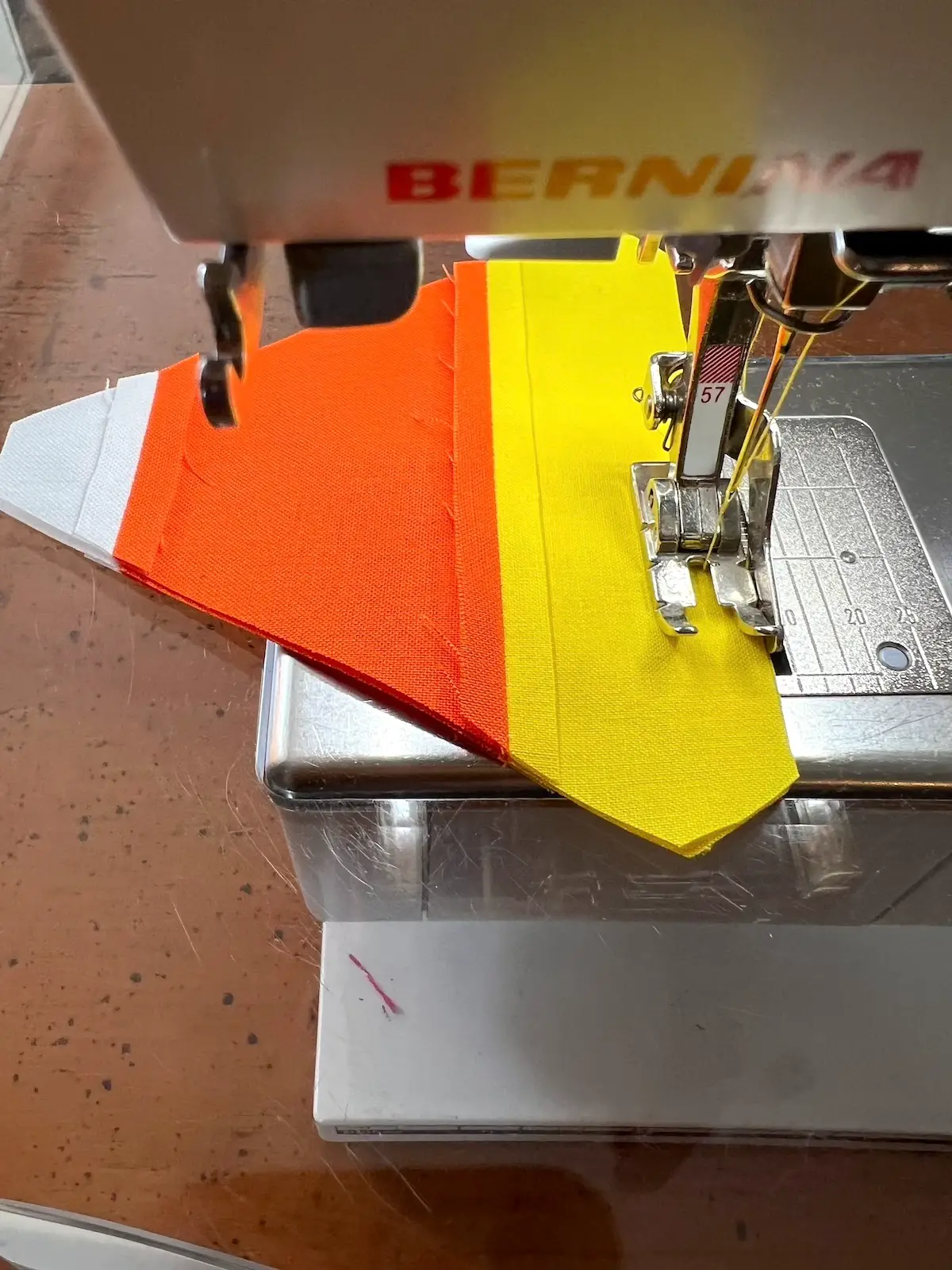 Begin sewing about 1 inch from the corner on the yellow strip for the candy corn