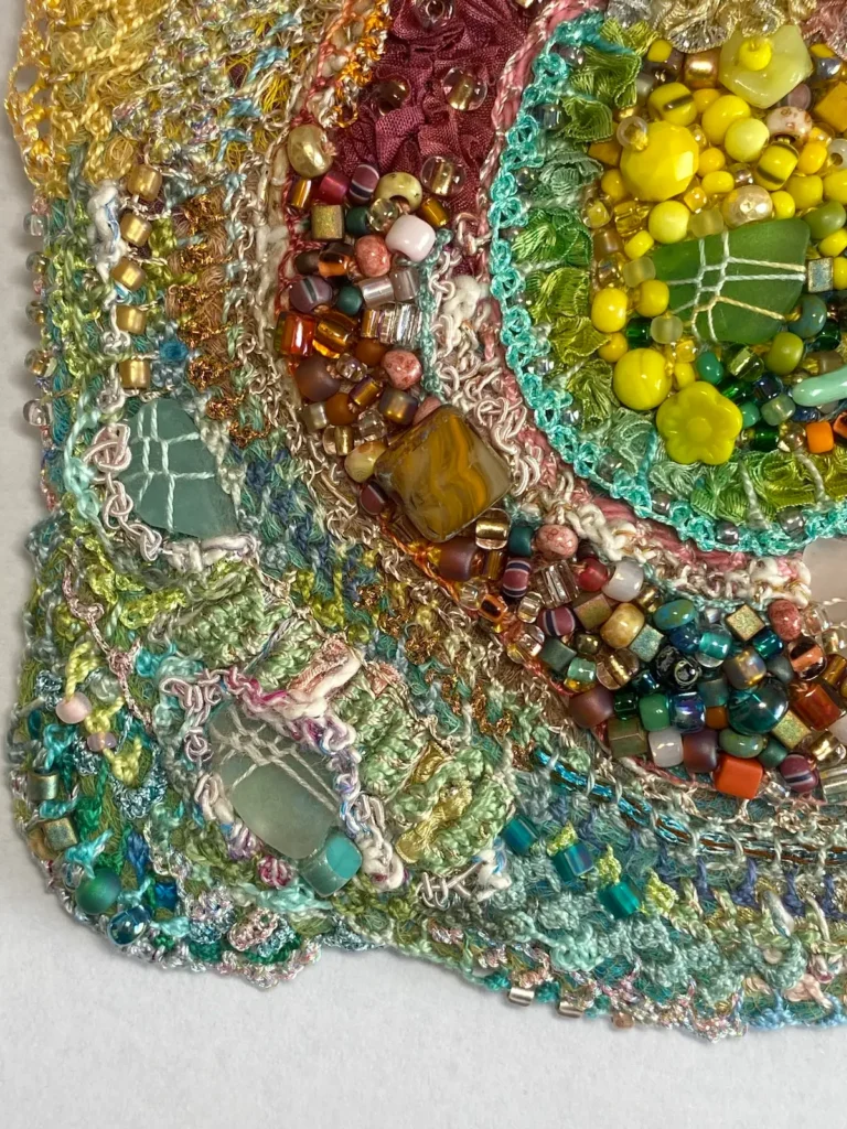 Cape Dreams detail of the beaded fiber art by Julie Booth