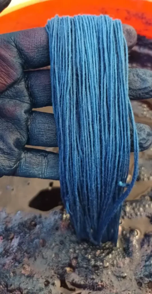 Blue yarn naturally dyed by Mildred & Sama of Suula