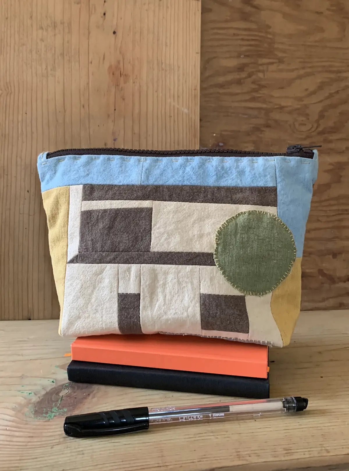 Zip bag made from naturally dyed fabrics with pen and notebooks by Mildred & Sama of Suula