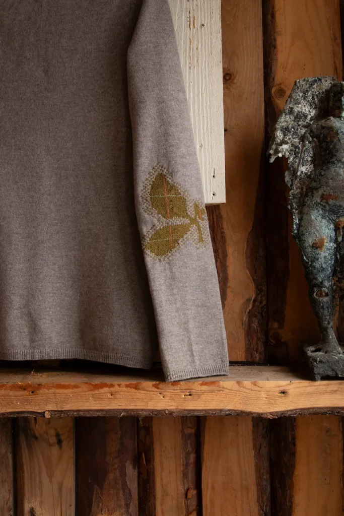 Grey and mustard mended sweater by Minttu Wikberg