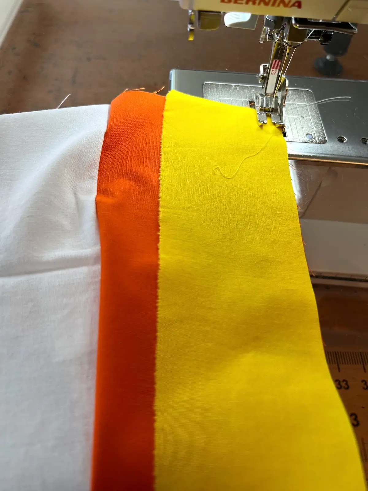 Sew the yellow strip to the center orange strip for the candy corn bowlies