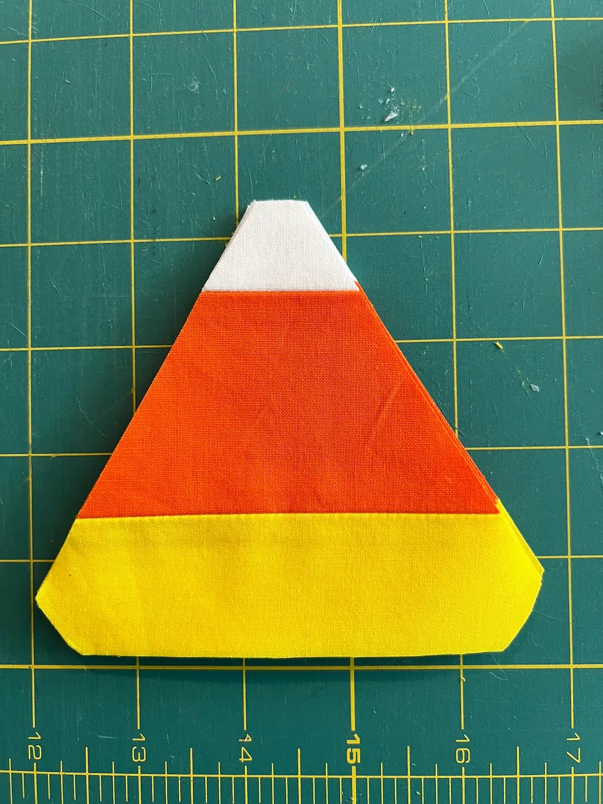Triangles with rounded corners are ready to sew into candy corn