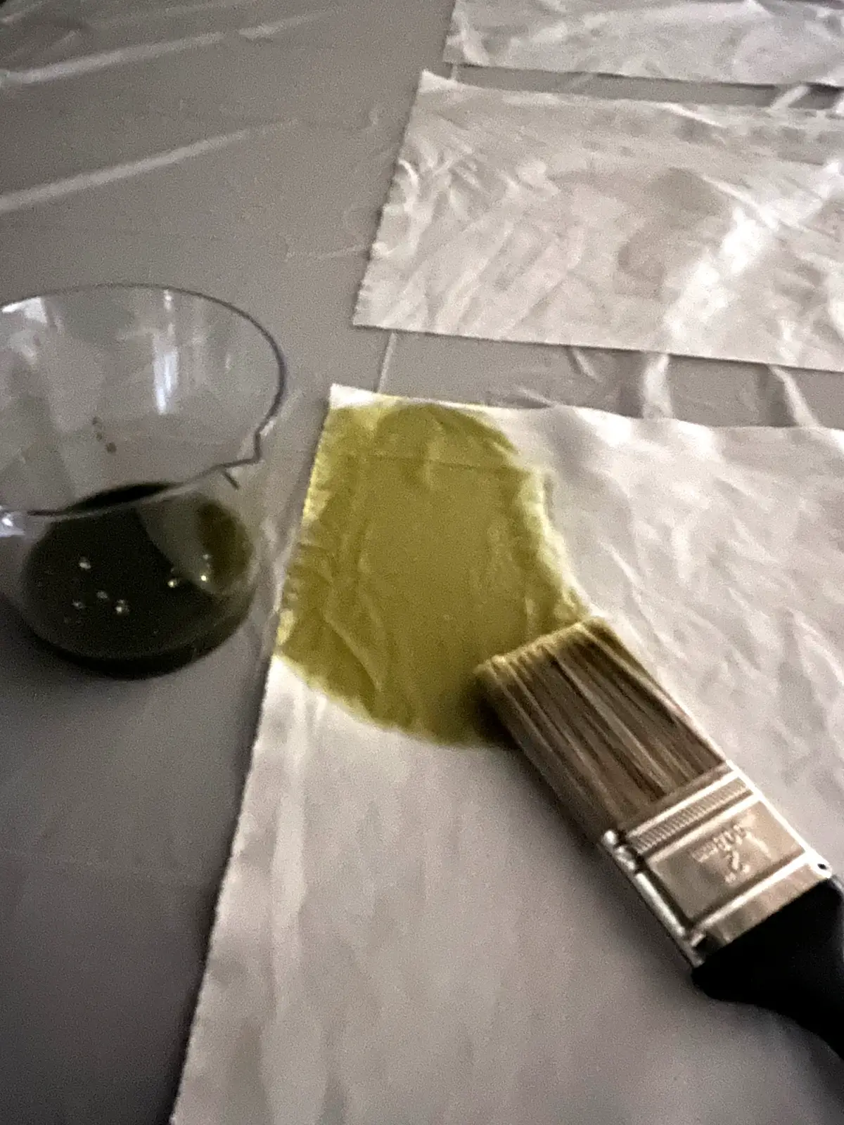 Painting the cyanotype solution on fabric