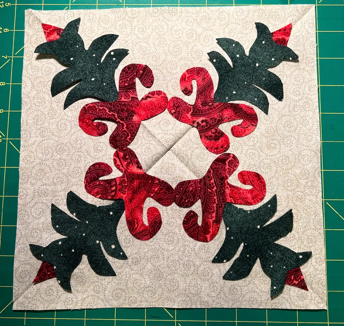 Next add the green plants, tucking in the bottom edges below the bottom of the Christmas Cactus plant. Lastly tuck the bud into the top of the green plant.