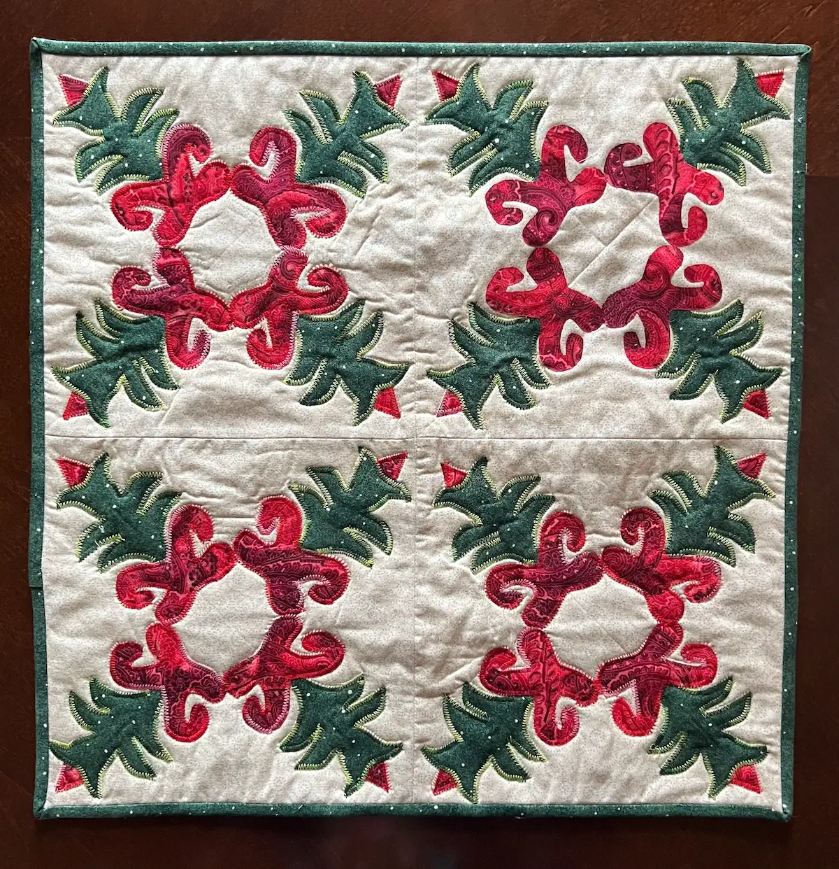 Christmas Cactus finished wall hanging with four quilt blocks