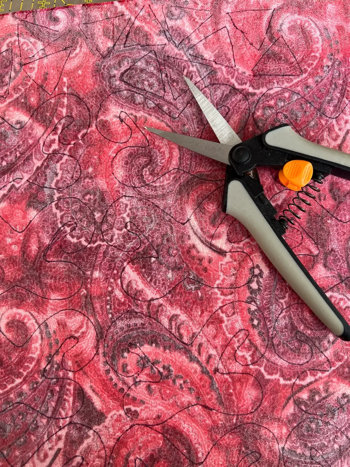 Here are the elements that are in the red fabric all traced to the wrong side of the fabric that has the fusible web applied and ready to be cut out for the Christmas Cactus quilt block