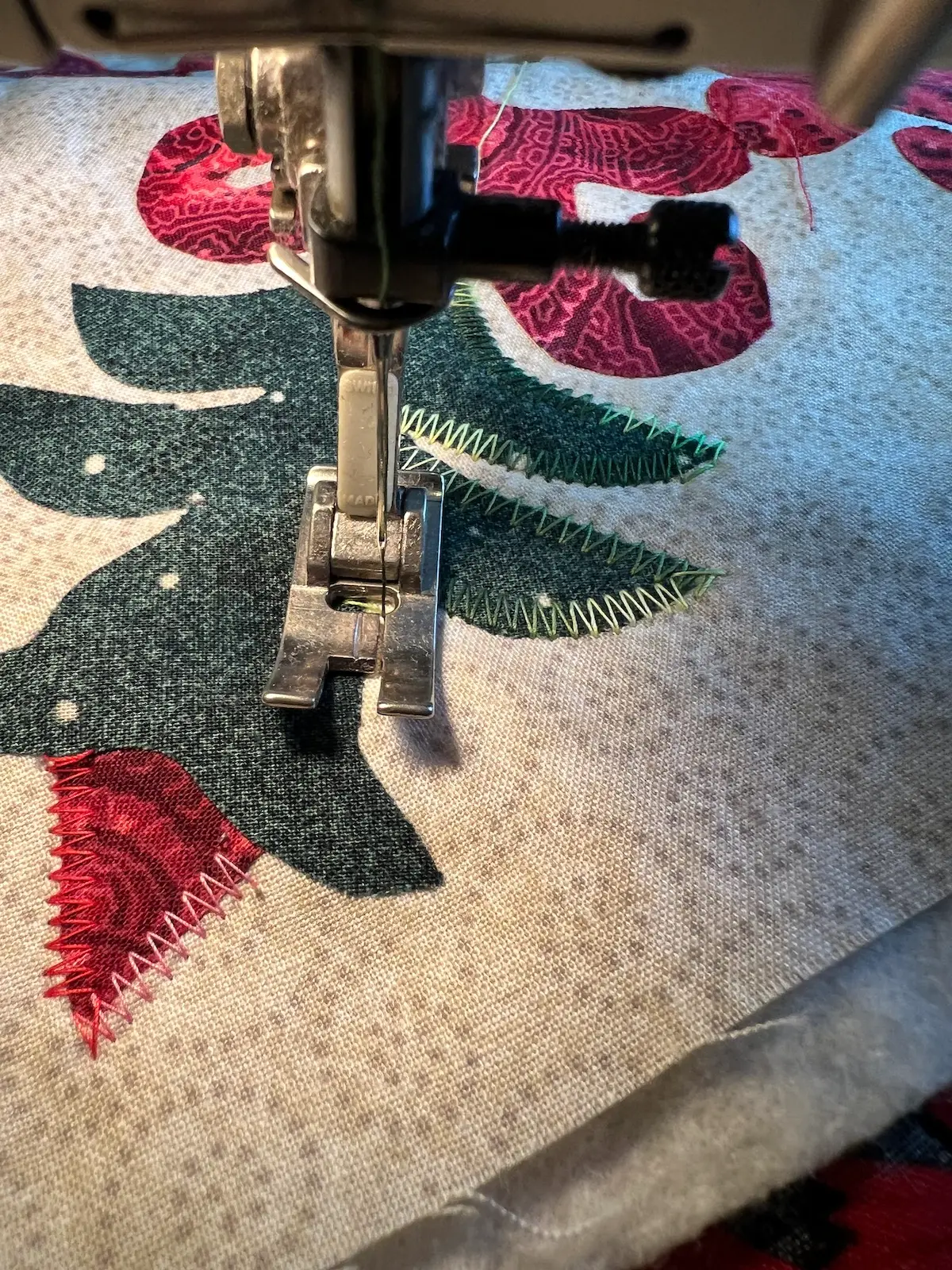 Stitching in progress on the green plant part of the Christmas Cactus