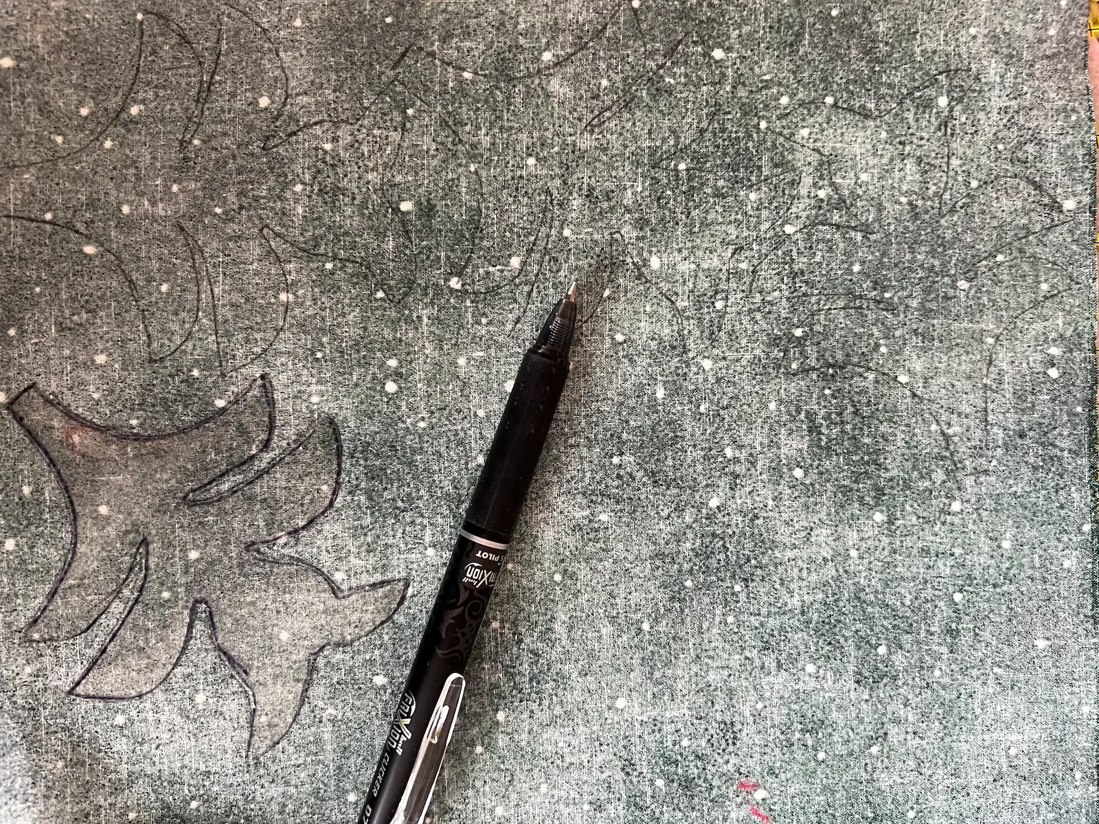 Use a removable fabric marker to trace around the template to the wrong side of the fabric already prepared with fusible web for the Christmas Cactus quilt block