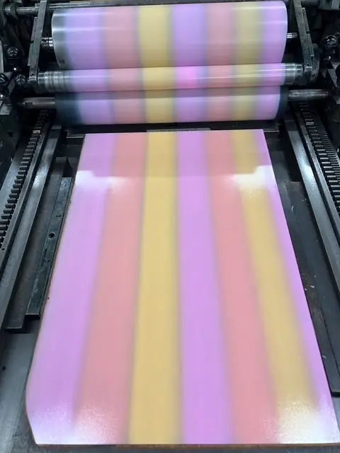 Jenn Graves with the inks coming off the press