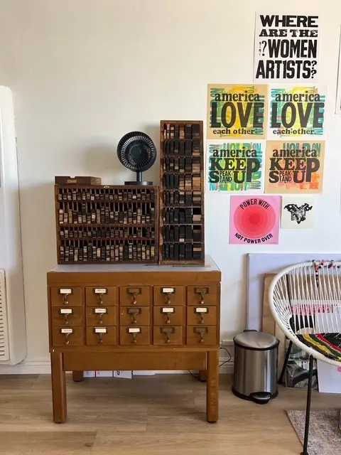 Jenn Graves types on display in vintage type cases