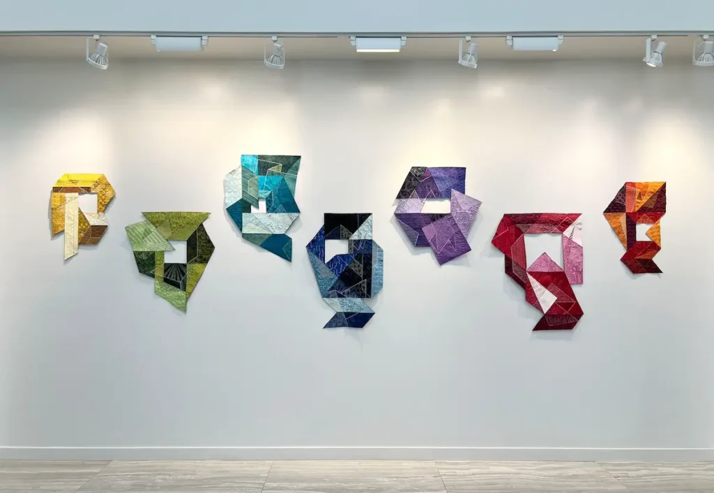 Unfolding series of 7 art quilts designed and made by Lauri Jones