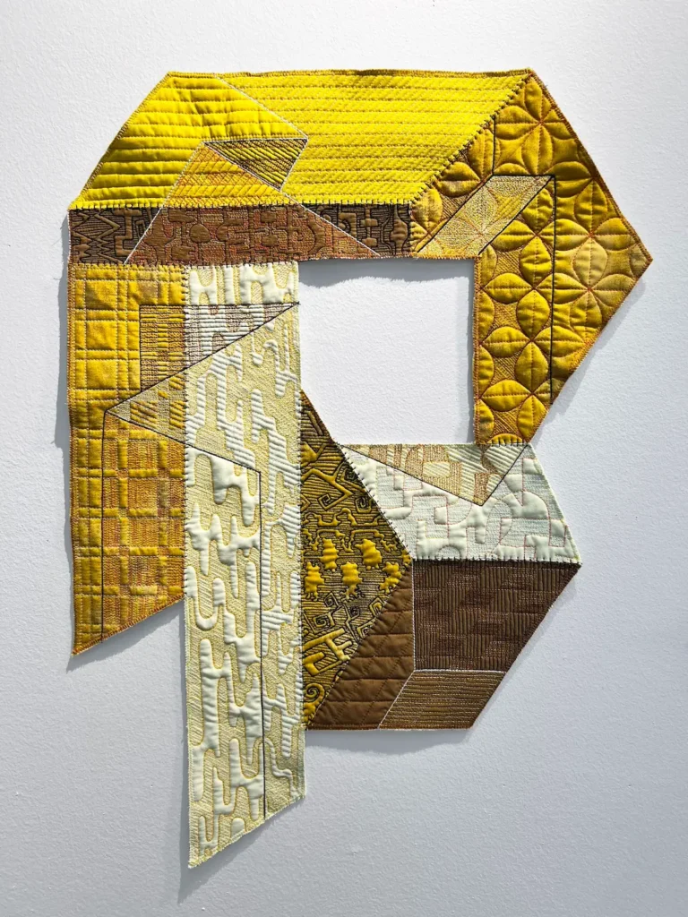 Unfolding Yellow art quilt designed and made by Lauri Jones