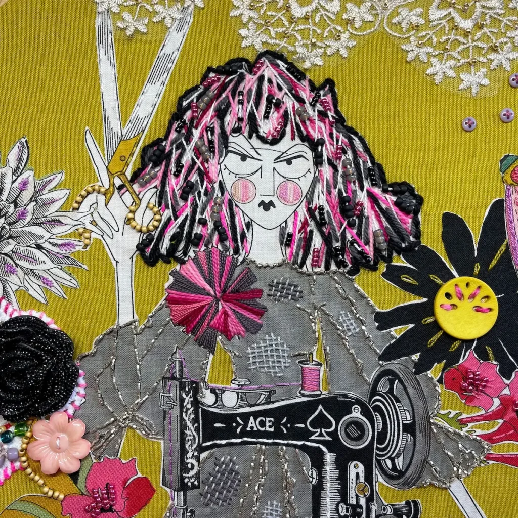 Detail of an embroidered and beaded piece of fabric with a woman with scissors by Nichole Vogelsinger