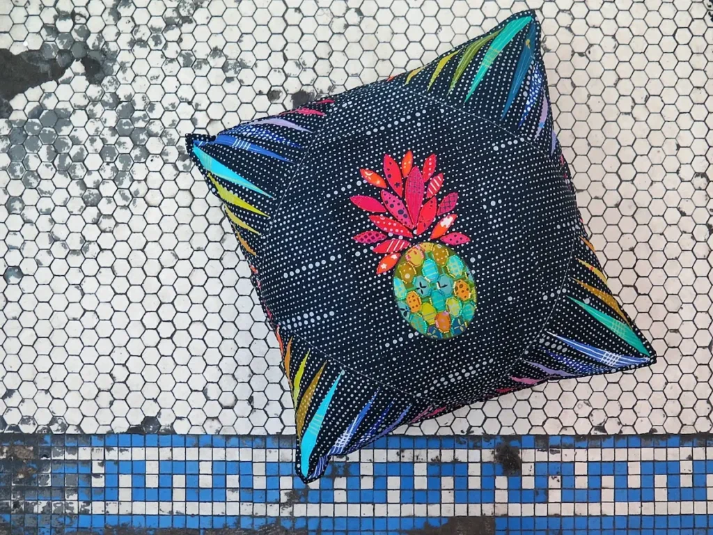 Pillow with hand stitching by Nichole Vogelsinger