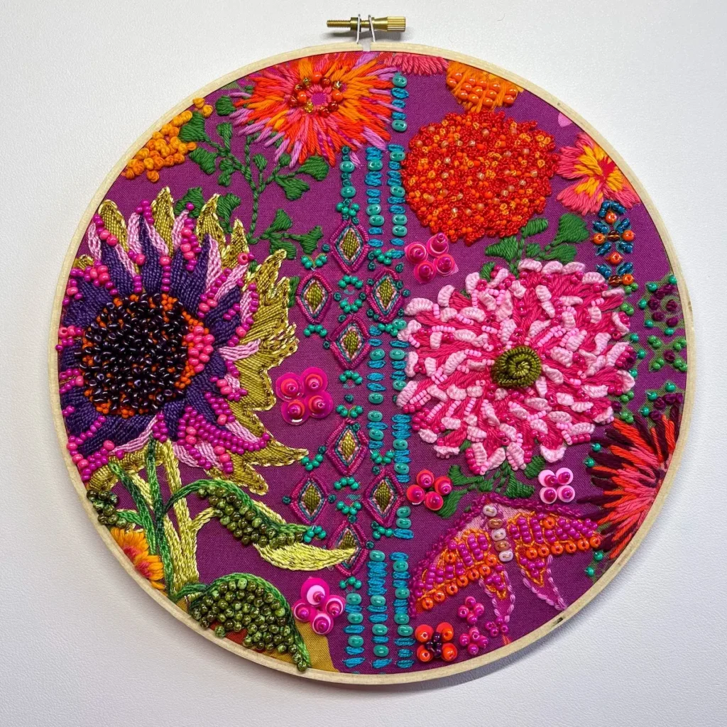 Flower bead and embroidered fabric by Nichole Vogelsinger