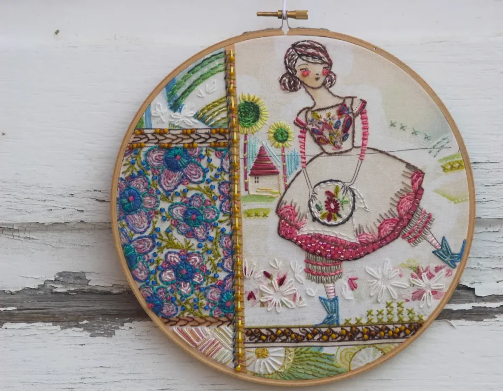 Vintage embroidery with new stitching by Nichole Vogelsinger