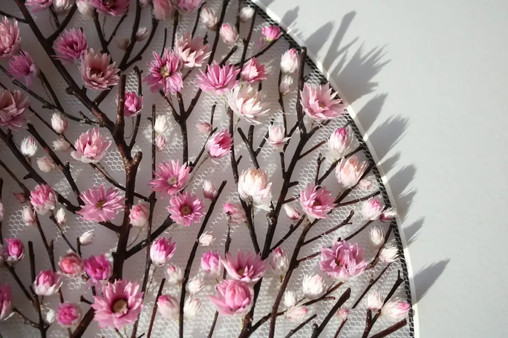 Close up of pink flowers on the finished piece in a frame by Olga Prinku