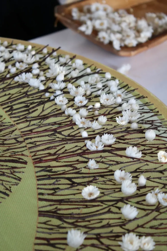 Close up of a work on green tulle by Olga Prinku