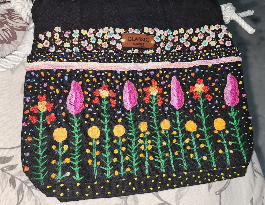 Embroidered purse by Radhika Vyas
