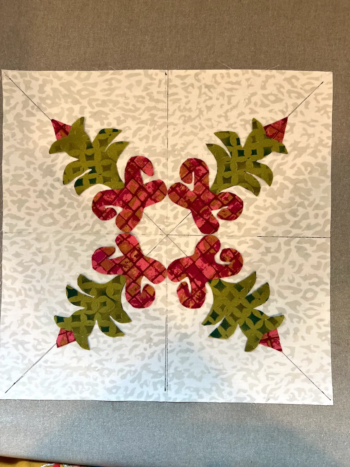 Christmas Cactus quilt block applique pieces layed out and ready to be fused