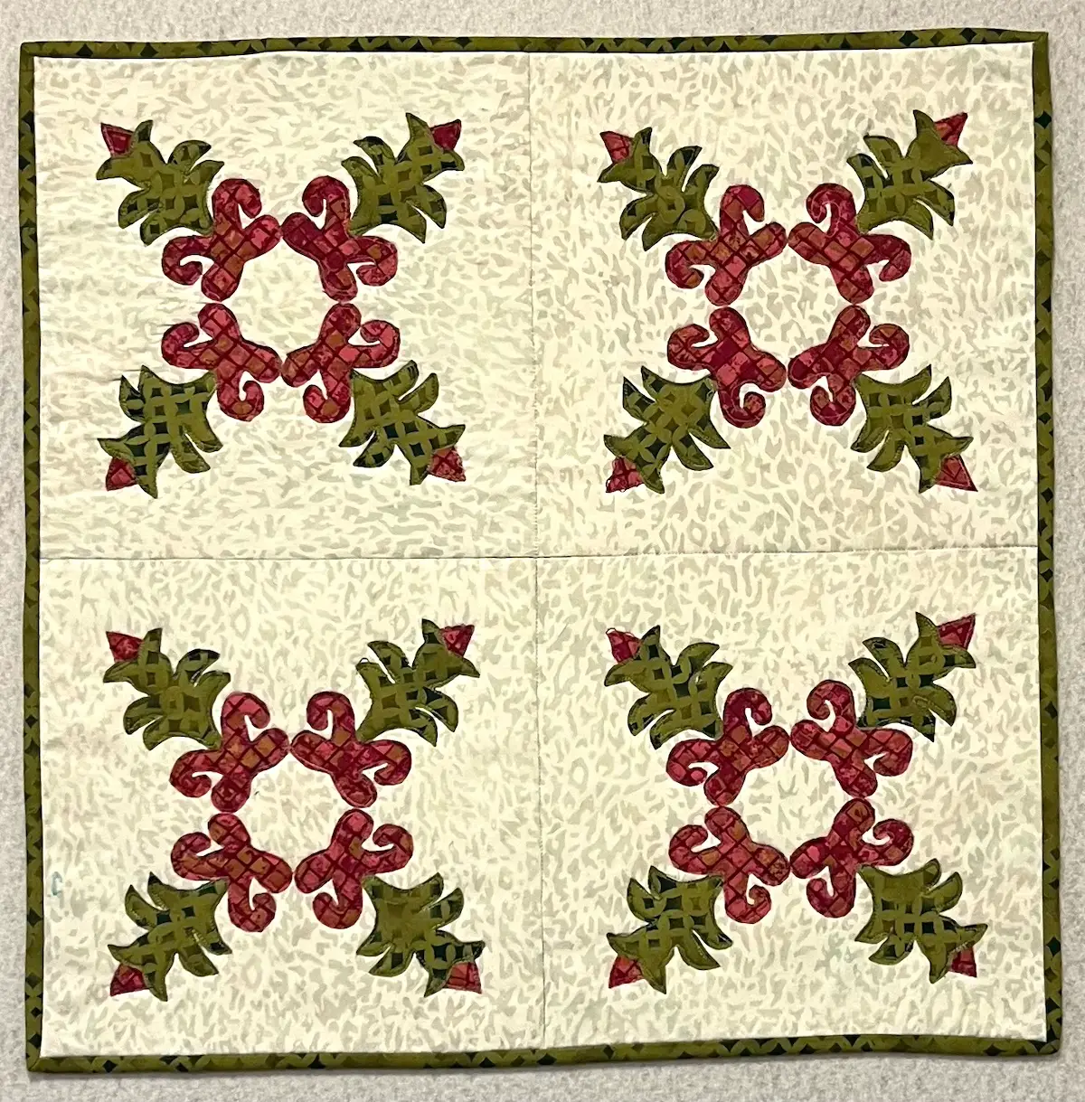 Finished Christmas Cactus quilt block on the design wall
