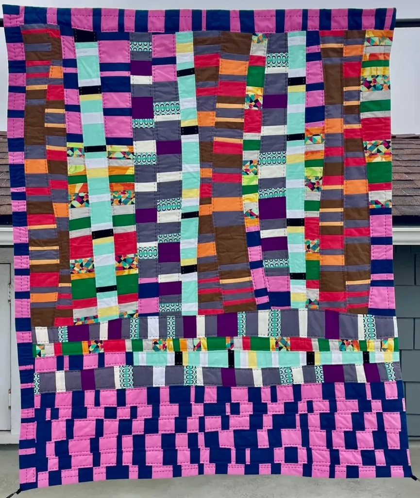 Quilt made by Ethylene Ziegler and donated and sold at the Modern for Modern auction to benefit the MQG