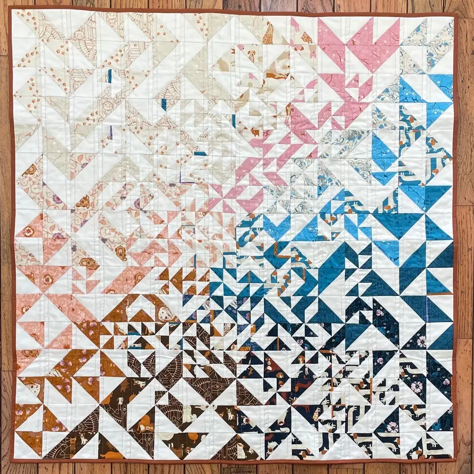 Scrap quilt with half square triangles by Ethylene Ziegler