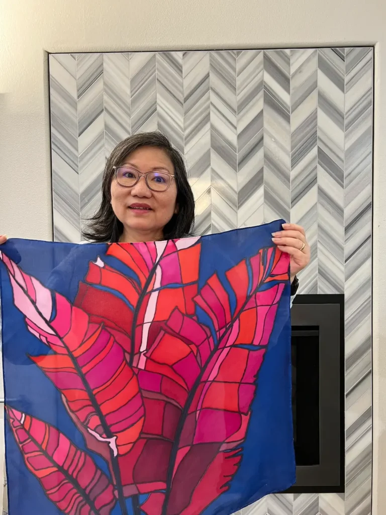 Evette Allerdings holding a scarf she was teaching beginner students