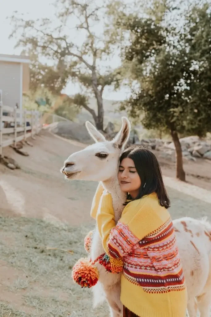 Olivia Arreguín Villa and a vicuña