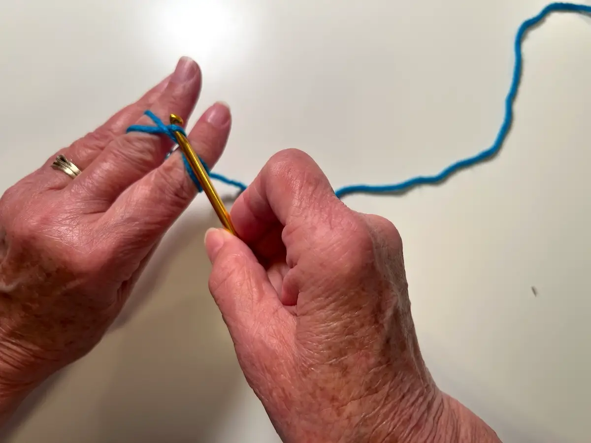Bring the yarn to the front side for the magic circle for the granny square