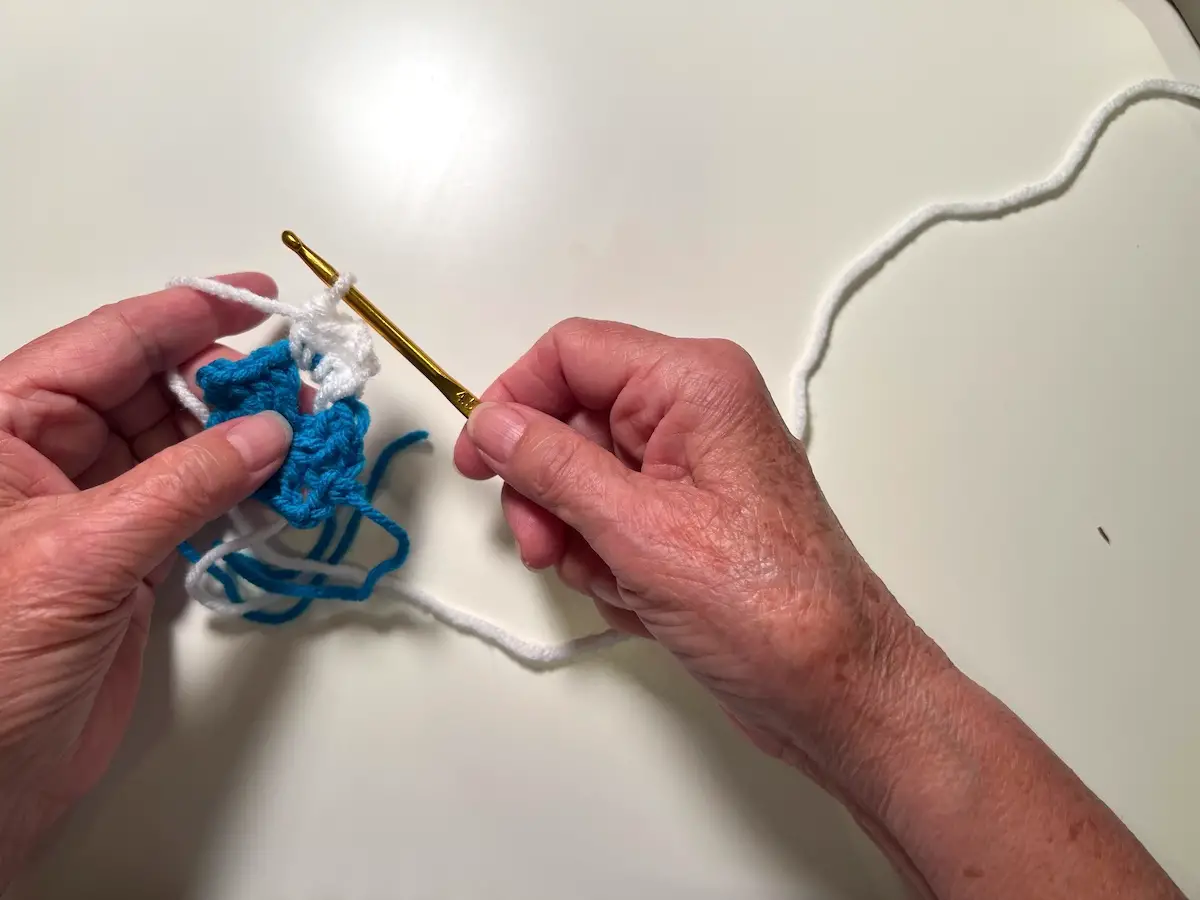 The first three stitches are done for the second round of the granny square