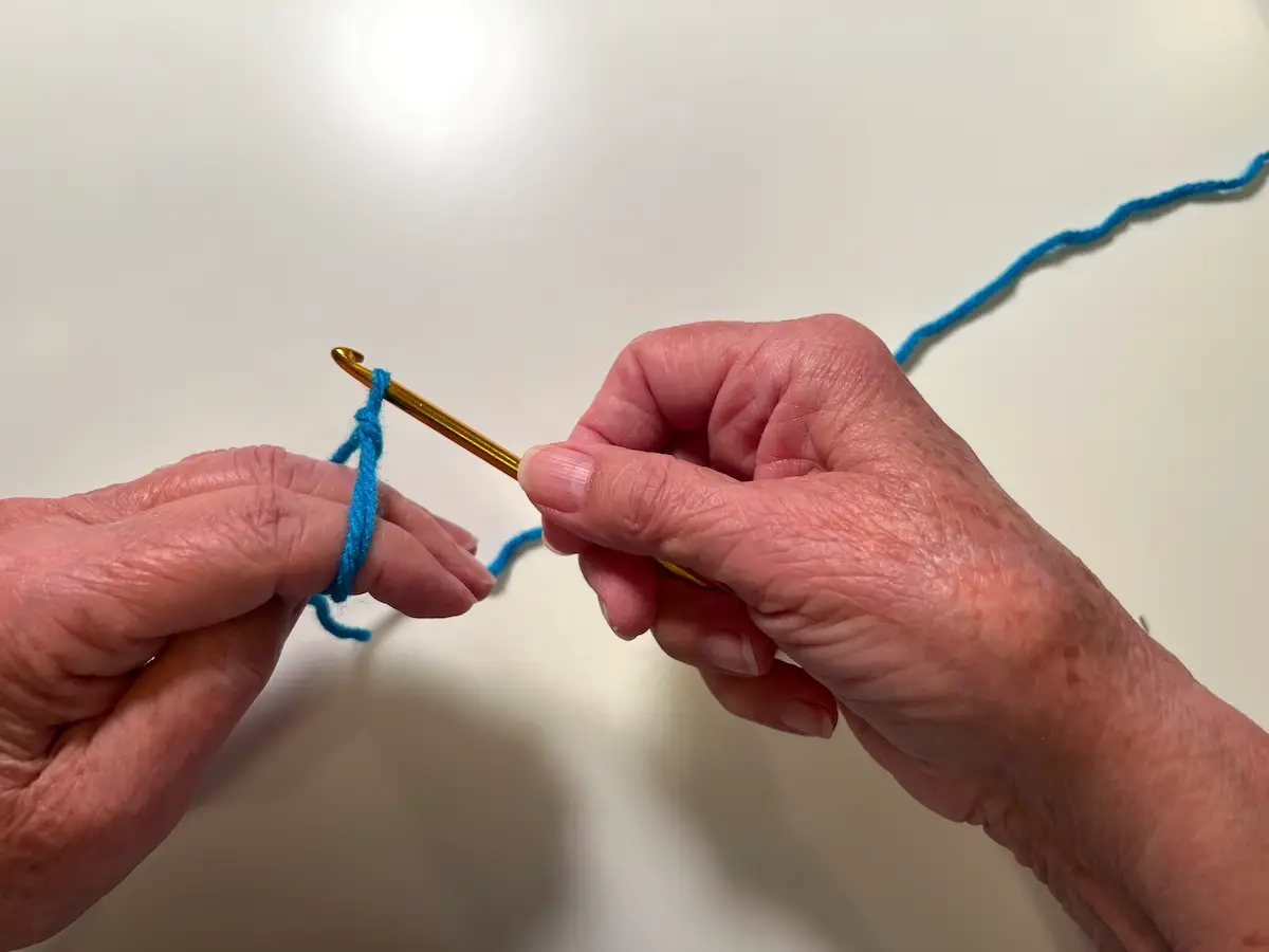 Pull the yarn through forming a loop for the magic circle for the granny square