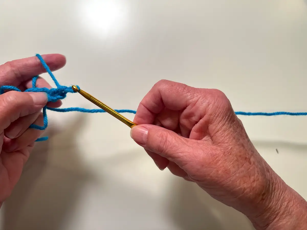 Here is the finished first double crochet stitch for the granny square
