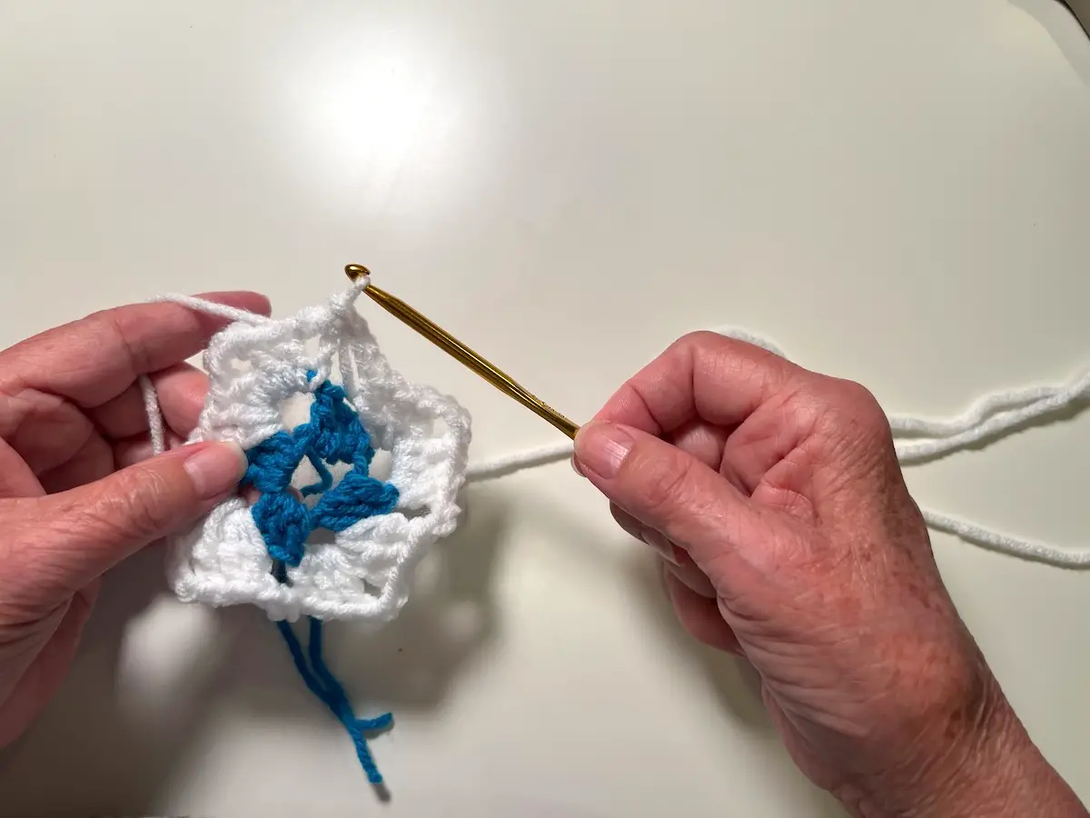 Here is the granny square with two rounds finished