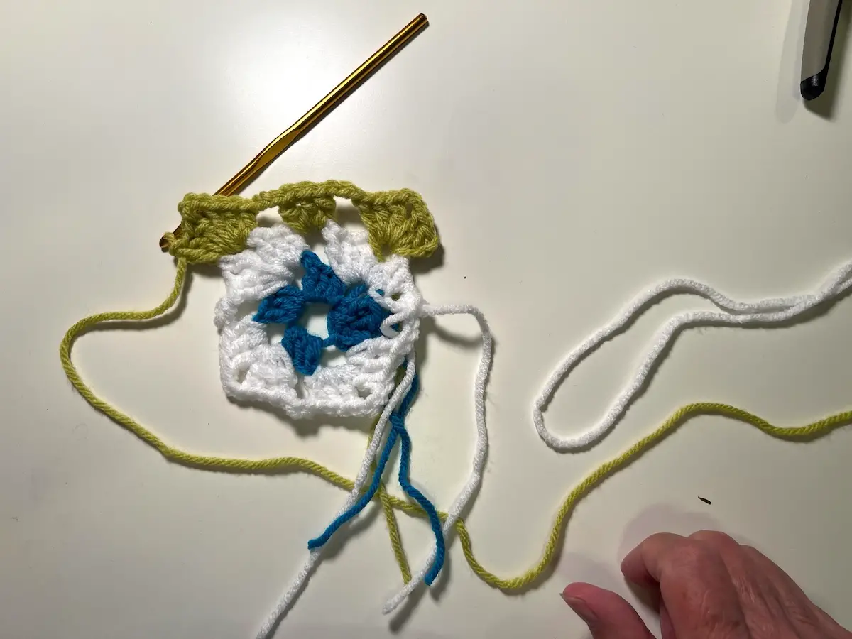 Here is half of the 3rd round of the granny square completed