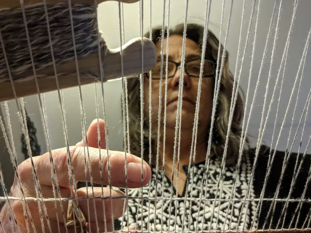 Brenda Schloesser weaving