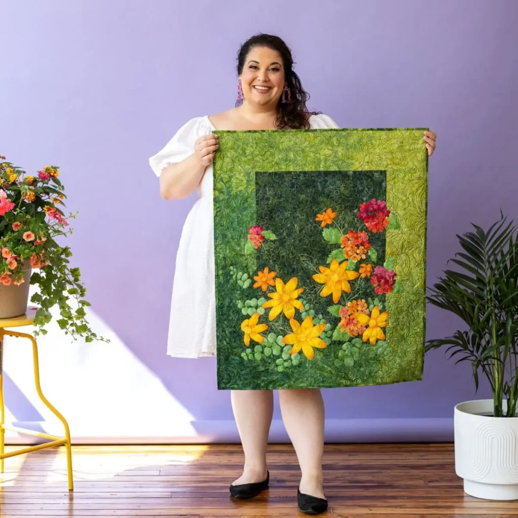 Lauren Weber with a flower quilt