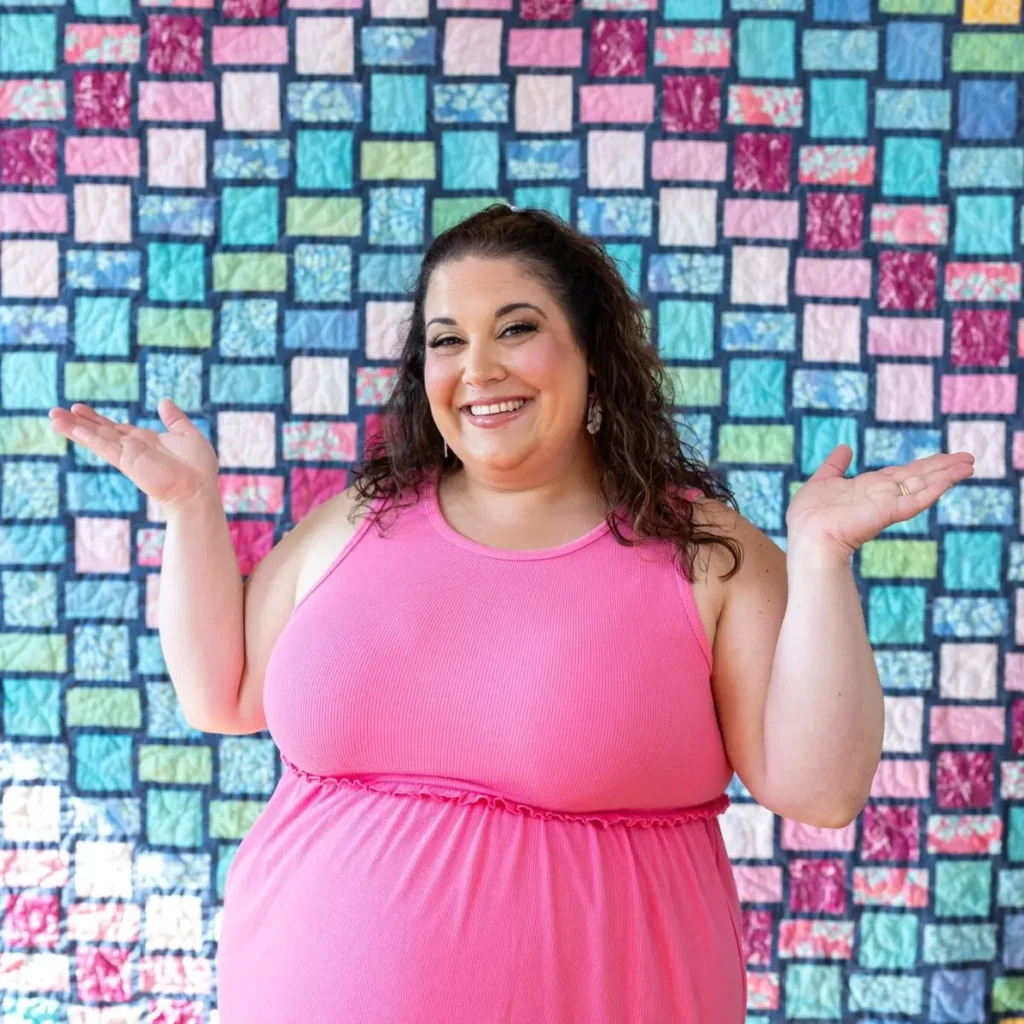 Lauren Weber with a quilt behind her