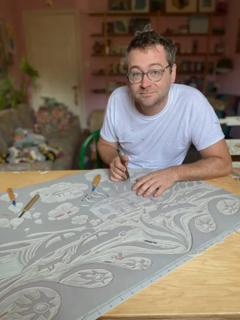 Charles Spitzack working on a large block print