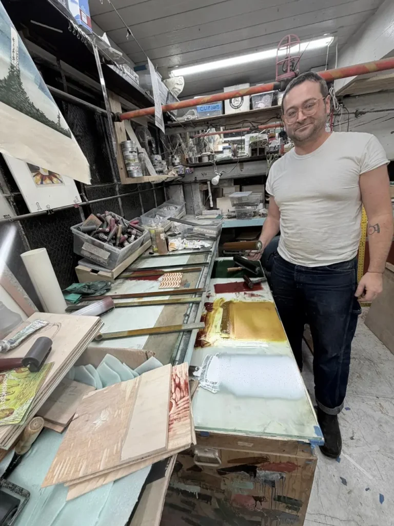 Charles Spitzack standing in his workshop