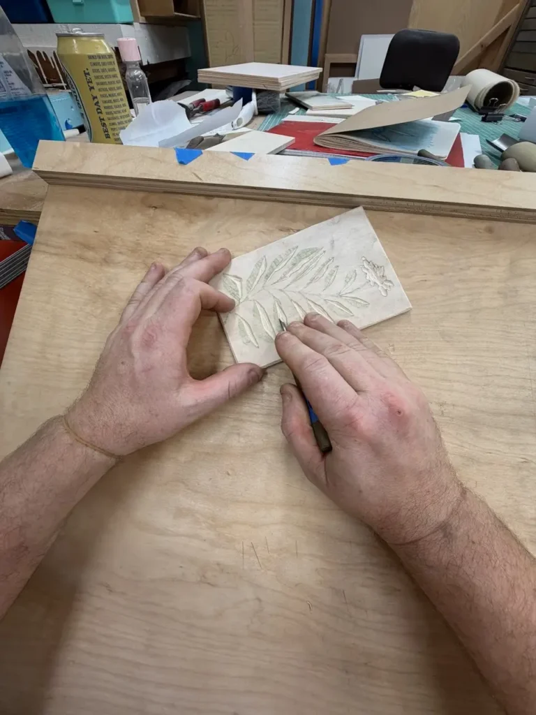 Charles Spitzack working on a block print