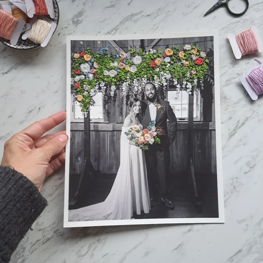 Embroidered wedding picture with row of flowers by Katia Herrera