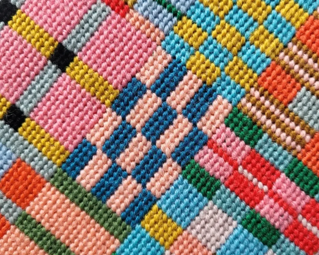 Close up of a needlepoint piece by Miesje Chafer