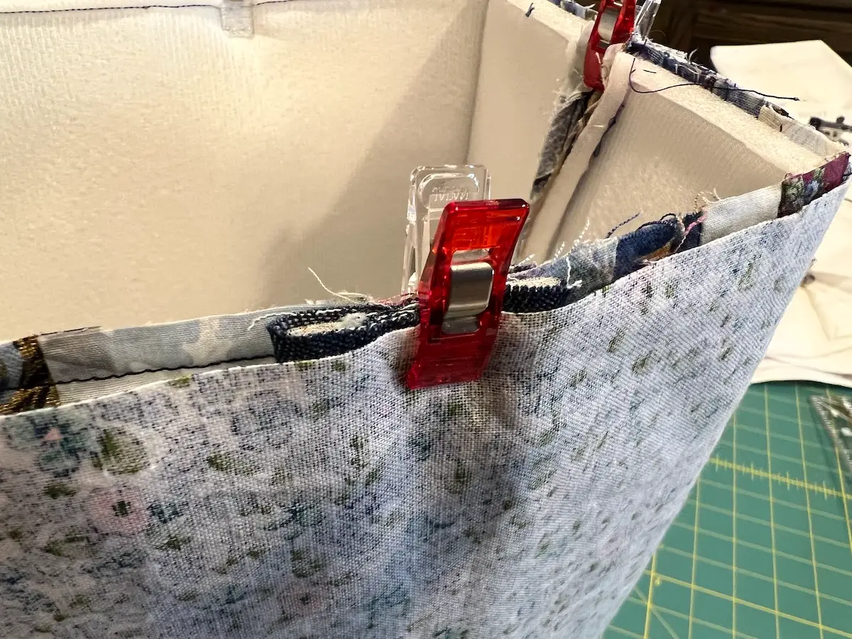 Blue patchwork bag clip handles in place