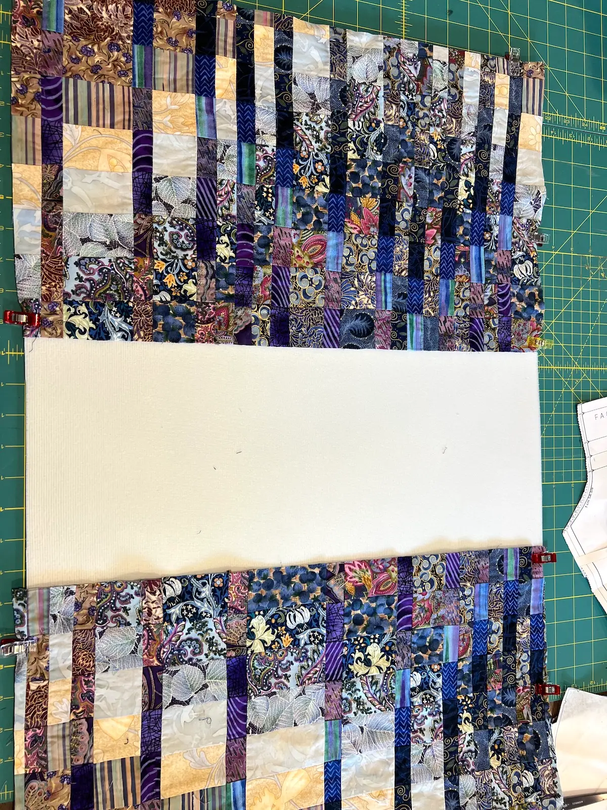 Blue patchwork bag lay the patchwork on either end of the foam